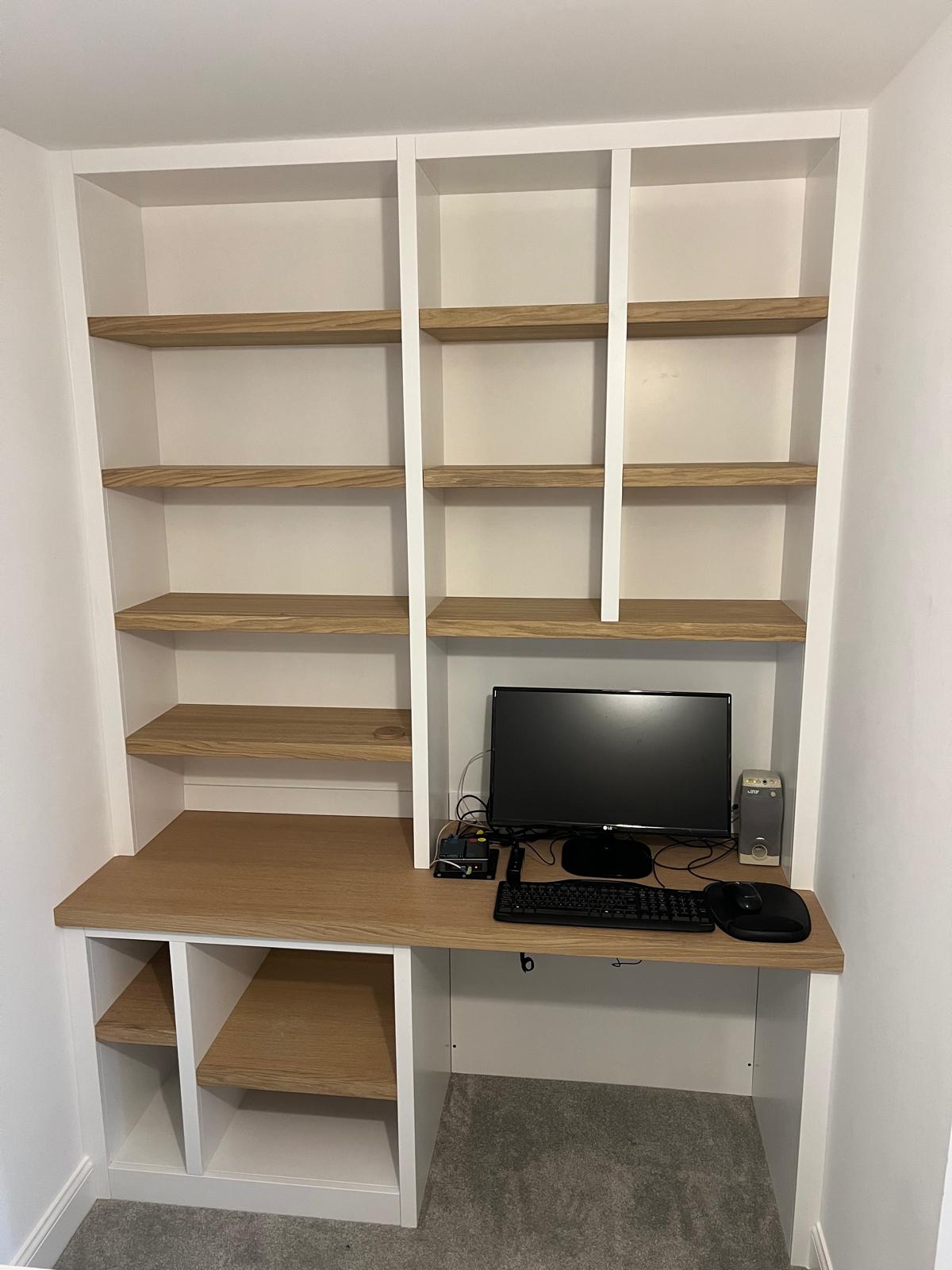 Bespoke home office with fitted desk, oak shelving and cable-managed workstation