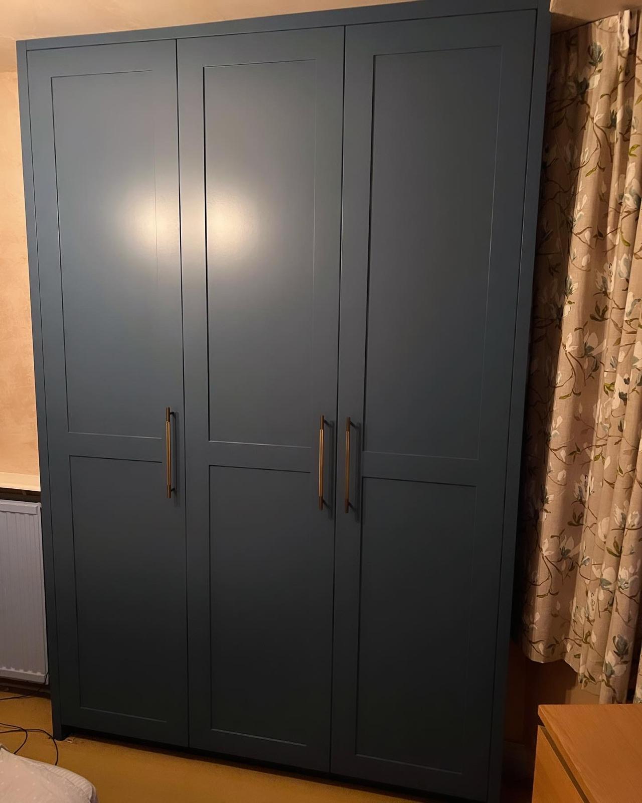 Bespoke navy fitted wardrobe with brushed handles, handmade in South Oxfordshire